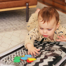 Load image into Gallery viewer, Black and white water mat, baby water mat, high contrast water mat, black and white baby toy, tummy time mat, Young wonderer, Young wonderer baby boutique, black and white baby toy, australian baby boutique, high contrast toy, baby toy, tummy time toy, sensory toy, baby sensory, sensory mat
